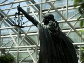 Vancouver, BC: April 05, 2016 -- Scales of Justice statue at BC Supreme Court in Vancouver, BC Thursday, May 5, 2016.