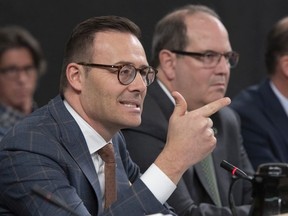 Desjardins president and CEO Guy Cormier testifies at a legislature committee, Thursday, November 21, 2019 at the legislature in Quebec City. Desjardins first vice president Denis Berthiaume, right, looks on.