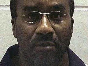 Ray Cromartie, convicted of shooting and killing a convenience store clerk more than 20 years ago, is seen in this undated handout photo taken at an unknown location.