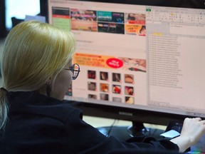 This picture taken on July 24, 2017 shows an employee of Santa Cruise "digital laundry" company monitoring a computer screen to find "revenge porn" at the company in Seoul. (JUNG YEON-JE/AFP/Getty Images)