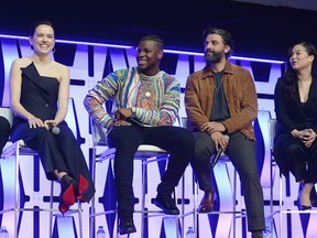 Daisy Ridley (Rey), John Boyega (Finn), Oscar Isaac (Poe Dameron) and Kelly Marie Tran (Rose Tico) onstage during "The Rise of Skywalker" panel at the Star Wars Celebration at McCormick Place Convention Center on April 12, 2019 in Chicago. (Daniel Boczarski/Getty Images for Disney )