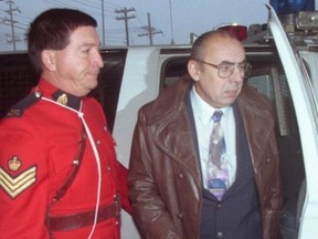 Roger Warren (right) is escorted from an RCMP van to the courthouse in Yellowknife in this Oct.24, 1994 file photo.