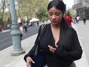 R. Kelly's girlfriend Joycelyn Savage leaves his status hearing scheduled in the racketeering and sex trafficking case in Brooklyn federal court in New York, Aug. 2, 2019.