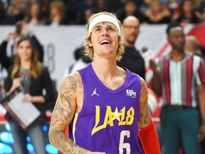 Justin Bieber smiles while playing in the celebrity game during the 2018 NBA all-star festivities in Los Angeles.
