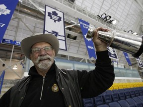 Toronto Maple Leafs great Eddie Shack holds up a mini Stanley Cup in this file photo.