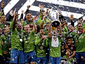 The Seattle Sounders celebrate with the MLS Cup after beating Toronto FC at CenturyLink Field. (Joe Nicholson-USA TODAY Sports)