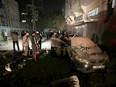 People gather at the scene of an Israeli strike that killed Islamic Jihad field commander Baha Abu Al-Atta in Gaza City Nove. 12, 2019.