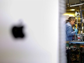 Flextronics International Apple factory employees work on Apple Mac Pro computer assembly in Austin, TX, U.S., November 20, 2019.