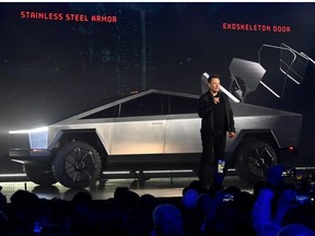 Tesla CEO Elon Musk unveils the Cybertruck at the TeslaDesign Studio in Hawthorne, Calif.