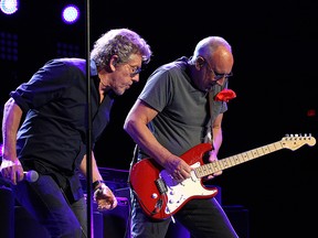 Vocalist Roger Daltry (left) looks on as Pete Townshend plays guitar as The Who perform at MTS Centre in Winnipeg on Wed., May 4, 2016. (Kevin King/Postmedia Network)