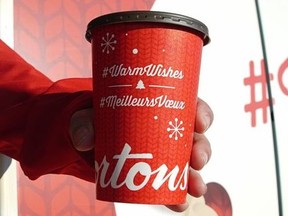 All six Tim Hortons Coffee Trucks will be offering free cups of Canada's favourite brew in new holiday-themed cups. (CNW Group/Tim Hortons)