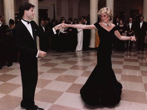 In this Nov. 9, 1985, photo provided by the Ronald Reagan Library, actor John Travolta dances with Princess Diana at a White House dinner.