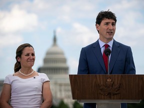Prime Minister Justin Trudeau speaks as Foreign Minister Chrystia Freeland listens during a news conference at the Canadian Embassy, in Washington June 20, 2019. (REUTERS/Al Drago/File Photo)
