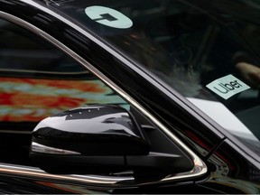 Uber sign is seen on a car in New York, U.S., April 12, 2019.