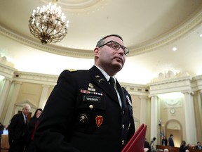 Lt. Colonel Alexander Vindman, director for European Affairs at the National Security Council, stands up for a break in his testimony before a House Intelligence Committee hearing as part of the impeachment inquiry into U.S. President Donald Trump on Capitol Hill in Washington, D.C., Nov. 19, 2019.