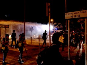 Police use a water cannon during an anti-government demonstration in Hong Kong, China, Nov. 5, 2019.