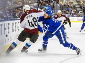 Toronto Maple Leafs' Kasperi Kapanen takes an elbow from Colorado Avalanche defenceman Calle Rosen during Wednesday's game at the Scotiabank Arena. (Ernest Doroszuk/Toronto Sun)