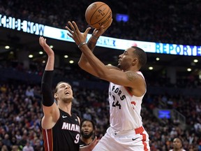 Toronto Raptors guard Norman Powell shoots the ball over Miami Heat forward Kelly Olynyk during Tuesday's game. (USA TODAY SPORTS)