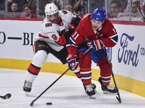 Dylan DeMelo battles against the Canadiens' Brendan Gallagher on Wednesday in Montreal. DeMelo broke a finger later in the game.