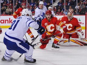 Maple Leafs’ John Tavares takes a shot on Flames goalie David Rittich on Thursday in Calgary. Tavares’ line was on the ice for two of Calgary’s three goals during a rally in the third period.