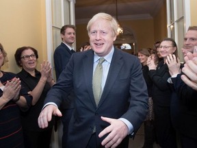 British Prime Minister Boris Johnson arrives back at 10 Downing Street after visiting Buckingham Palace where he was given permission to form the next government during an audience with Queen Elizabeth II on Dec. 13, 2019 in London, England.