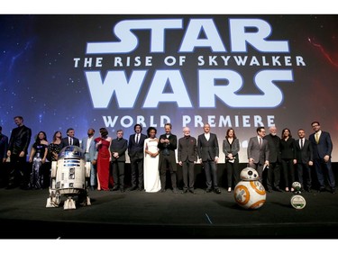 (L-R) Anthony Daniels, Billy Dee Williams, Joonas Suotamo, Kelly Marie Tran, Keri Russell, Oscar Isaac, John Boyega, Daisy Ridley, Mark Hamill, Adam Driver, Naomi Ackie, Richard E. Grant, Ian McDiarmid, The Walt Disney Company chairman and CEO Bob Iger, producer and president of Lucasfilm Kathleen Kennedy, director, writer and producer J.J. Abrams, composer John Williams, producer Michelle Rejwan, Writer Chris Terrio and executive producer Callum Greene speak onstage during the 
world premiere of "Star Wars: The Rise of Skywalker," the highly anticipated conclusion of the Skywalker saga on Dec. 16, 2019 in Hollywood, Calif.