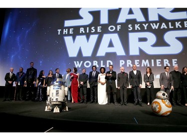 (L-R) Anthony Daniels, Billy Dee Williams, Joonas Suotamo, Kelly Marie Tran, Keri Russell, Oscar Isaac, John Boyega, Daisy Ridley, Mark Hamill, Adam Driver, Naomi Ackie, Richard E. Grant, Ian McDiarmid, The Walt Disney Company chairman and CEO Bob Iger, producer and president of Lucasfilm Kathleen Kennedy, director, writer and producer J.J. Abrams, composer John Williams and producer Michelle Rejwan speak onstage during the 
world premiere of "Star Wars: The Rise of Skywalker," the highly anticipated conclusion of the Skywalker saga on Dec. 16, 2019 in Hollywood, Calif.