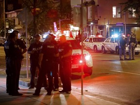Toronto Police officers on Danforth Ave. after a shooting spree on July 22, 2018.