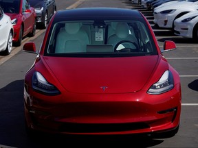 A new Tesla Model 3 is shown at a delivery center on the last day of the company's third quarter, in San Diego, Calif., Sept. 30, 2019. REUTERS/Mike Blake/File Photo