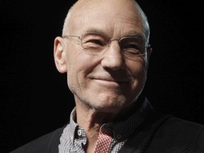 Sir Patrick Stewart, who played Capt. Jean-Luc Picard, walks on-stage to join the rest of the Star Trek: the Next Generation cast on its 25 anniversary during the Calgary Comic and Entertainment Expo at the Corral in Calgary on Saturday, April 28, 2012.
