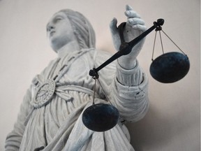 This file photo taken on May 19, 2015 shows a picture taken on May 19, 2015 at Rennes' courthouse shows a statue of the goddess of Justice balancing the scales. Due to serious stationary shortages in the French justice system, people working in the duty offices get basic office supplies from the other departments, as stated by Vice-Prosecutor of Brest, Isabelle Johanny, to AFP, who has lent supplies such as ink cartridges to her colleagues. / AFP / DAMIEN MEYERDAMIEN MEYER/AFP/Getty Images