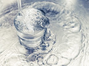 Clean water pours from a tap. (Getty Images)