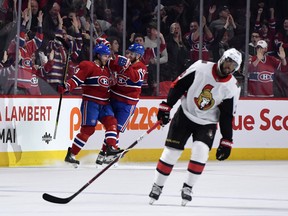 Montreal Canadiens defenCeman Ben Chiarot (8) reacts with teammate Joel Armia (40) after scoring the winning goal during the overtime period against the Ottawa Senators at the Bell Centre. Eric Bolte-USA TODAY Sports ORG