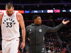 Toronto Raptors guard Kyle Lowry (right) helps centre Marc Gasol (33) off the floor during a timeout in the first quarter against the Detroit Pistons at Little Caesars Arena. Tim Fuller-USA TODAY Sports