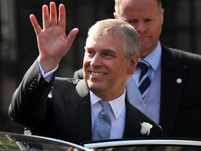 In this file photo taken on July 30, 2011 Britain's Prince Andrew leaves after attending the wedding of Zara Phillips, granddaughter of Britain's Queen Elizabeth II, and England rugby player Mike Tindall at Canongate Kirk in Edinburgh, Scotland.