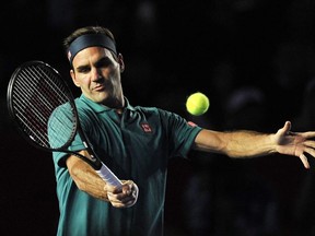 Switzerland's Roger Federer returns the ball to Germany's Alexander Zverev during their tennis exhibition singles match, in Mexico City, on November 23, 2019.