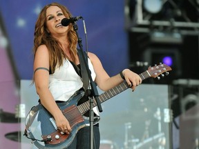 In this file photo taken on June 27, 2008 Canadian singer Alanis Morissette performs on stage at the Rock in Rio Madrid music festival in Arganda del Rey near Madrid.