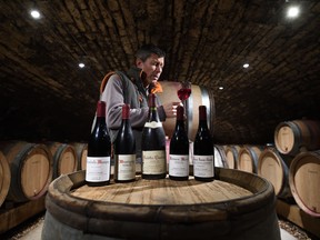 In this file photo taken on Dec. 20, 2017, French wine-grower Christophe Roumier tastes his wine in his cellar in Chambolle-Musigny (Burgondy). (ERIC FEFERBERG/AFP via Getty Images)