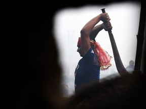 A Hindu devotee slaughters a buffalos as a offering during the Gadhimai Festival in Bariyarpur on December 3, 2019.