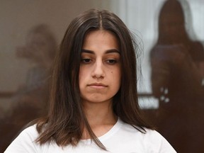 In this file photo taken on June 26, 2019 Angelina Khachaturyan, one of three teenage sisters accused of murdering their father, attends a hearing at a court in Moscow.