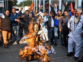 Activists from Shiv Sena Taksali shout slogans as they burn effigies of 'rapists' to protest against the alleged rape and murder of a 27-year-old veterinary doctor in Hyderabad, during a demonstration in Amritsar on December 5, 2019.