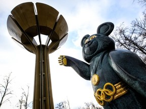 A sculpture of the mascot for the 1980 Moscow Olympics - Misha the bear - stands next to the 1980 Summer Olympics Cauldron near the Luzhniki stadium in Moscow on December 6, 2019.