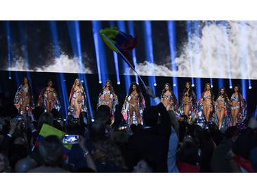 The top 10 finalists stand on stage for the swimsuit competition during the 2019 Miss Universe pageant at the Tyler Perry Studios in Atlanta, Ga., on Dec. 8, 2019.