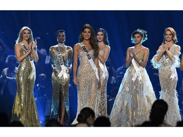 Miss Colombia Gabriela Tafur Nader (C) stands on stage during the 2019 Miss Universe pageant at the Tyler Perry Studios in Atlanta, Ga., on Dec. 8, 2019.