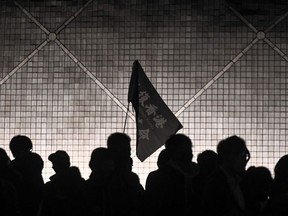 A flag of 'Free Hong Kong, Revolution of our times' is seen during a pro-democracy rally at the Salisbury Garden in Tsim Sha Tsui district of Hong Kong on December 13, 2019.