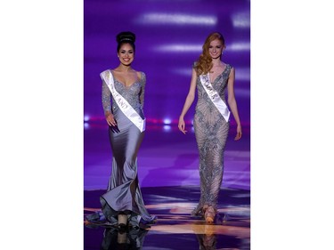 Miss England Bhasha Mukherjee (L) and Miss Denmark Natasja Kunde appear during the the Miss World Final 2019 at the Excel arena in east London on Dec. 14, 2019.