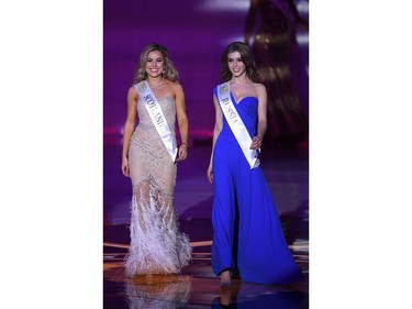 Miss Scotland Keryn Matthew (L) and Miss Russia Alina Sanko appear during the the Miss World Final 2019 at the Excel arena in east London on Dec. 14, 2019.