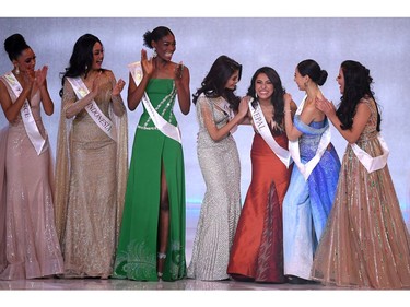 Miss Nepal Anushka Shrestha (3rd R) reacts after winning the Beauty with a Purpose award during the the Miss World Final 2019 at the Excel arena in east London on Dec. 14, 2019.