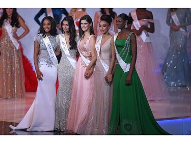 The final five (L-R) Miss Jamaica Toni-Ann Singh, Miss India Suman Ratansingh Rao, Miss Brazil Elis Coelho, Miss France Ophely Mezino and Miss Nigeria Nyekachi Douglas pose during the the Miss World Final 2019 at the Excel arena in east London on Dec. 14, 2019.