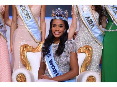 Newly crowned Miss World 2019 Miss Jamaica Toni-Ann Singh smiles as she poses with her crown during the Miss World Final 2019 at the Excel arena in east London on Dec. 14, 2019.
